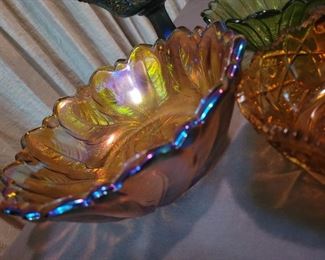 Carnival glass, amber glass, and various candy bowls