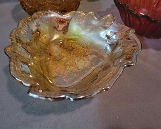 Carnival glass, amber glass, and various candy bowls