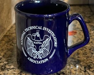 National Technical Investigators coffee Cup in God we trust all others we monitor 4in H x 3.25 in Diameter