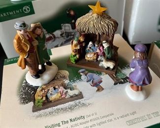 4 pc Dept. 56 Christmas in the City Series figurines. Visiting the nativity, to protect and to serve, handsome cab, picking out the Christmas tree