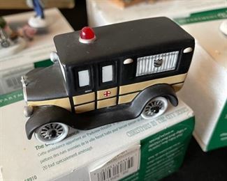 4pc Dept. 56 Christmas in the City figurines. Bringing home the baby, The city ambulance, Luigis gelato treats, fresh flowers for sale