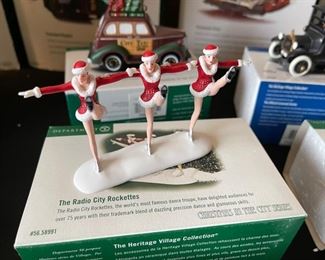 6pc Dept. 56 Christmas in the City Series. City taxi, 1919 Ford model T, city police car, radio city Rockettes, dressed for success, rest ye Merry gentlemen