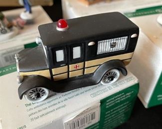 4pc Dept. 56 Christmas in the City figurines. Bringing home the baby, The city ambulance, Luigis gelato treats, fresh flowers for sale