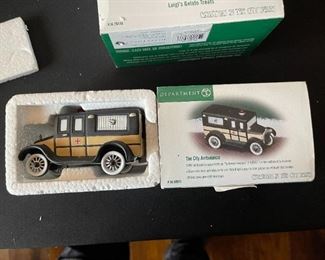 4pc Dept. 56 Christmas in the City figurines. Bringing home the baby, The city ambulance, Luigis gelato treats, fresh flowers for sale