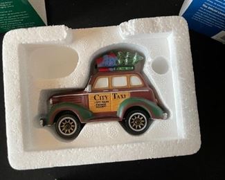 6pc Dept. 56 Christmas in the City Series. City taxi, 1919 Ford model T, city police car, radio city Rockettes, dressed for success, rest ye Merry gentlemen