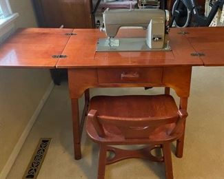 Kenmore Electric Rotary Sewing Machine in Cabinet with Chair, Accessory rack, manuals & Pamphlets Closed 29"W x 19.5"D x 30"H Opened 58"W Call