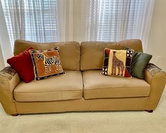 Pier One Two Cushioned Safari Style Sofa is 80in L
With 4 Accent Pillows: Zebra, Giraffe, Red, & Green
Upholstery is 100% Cotton
Matching Ottoman is in this auction
80in L x 30in H Seat, Cushion 18in H x 22in H