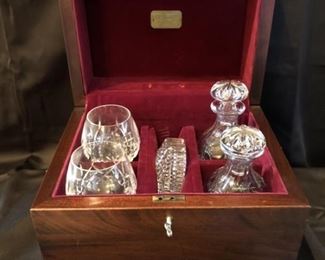 High-End Bar Set in Cartier Box with Waterford &
Cartier Box Measures 13in wide x 10in deep x 10in tall
2-Crystal Brandy Sniftters are 5.5in and are Marked Waterford 
2- Crystal Decanters are 7in & 7.5in and are Marked Tudor England
Crystal Ashtray is 4 inch Diameter and is Marked Waterford
