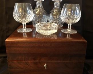 High-End Bar Set in Cartier Box with Waterford &
Cartier Box Measures 13in wide x 10in deep x 10in tall
2-Crystal Brandy Sniftters are 5.5in and are Marked Waterford 
2- Crystal Decanters are 7in & 7.5in and are Marked Tudor England
Crystal Ashtray is 4 inch Diameter and is Marked Waterford
