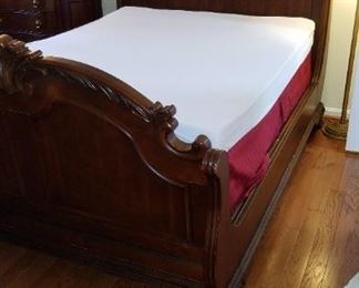 Queen bed, headboard, footboard and wooden side rails.  Aerobed memory foam mattress topper