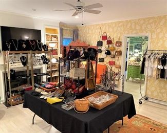 Tip of the iceberg! 12 clothing racks and a huge closet filled with designer clothing & accessories!