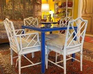 LOVE this MCM patent leather game table with studs and McGuire style chairs!