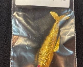 14k gold articulated fish pendant with ruby eyes