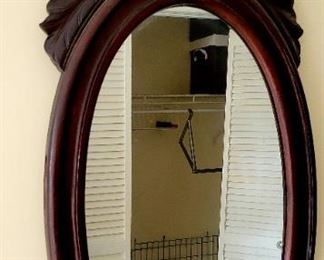 Oval wood framed mirror