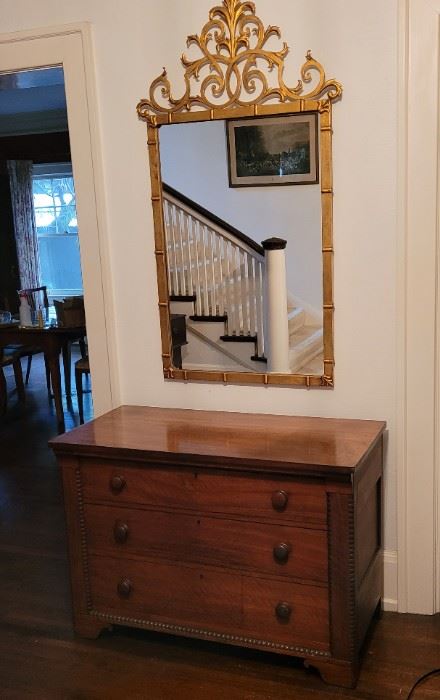 19th century chest and metal gilded mirror.