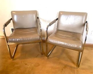 pair of chrome & tan leather arm chairs
