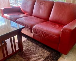 Red leather sofa with chrome feet & mission-style coffee table