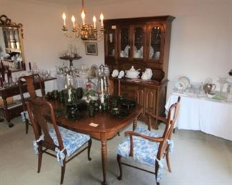 The dining room is full of beautiful furniture, china and glassware.  (This china cabinet is to stay with the home.)