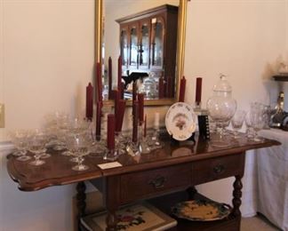 Mirror,  tea cart, crystal and lots of candlesticks.