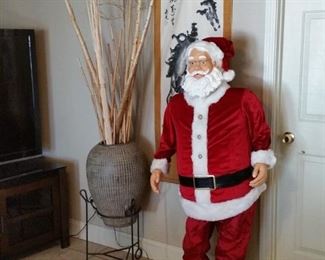 This large Santa dances and sings Christmas songs