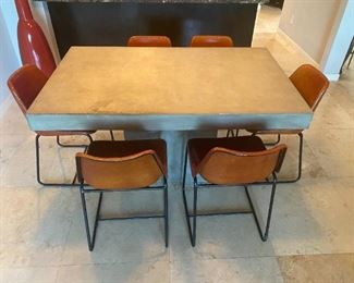 modern stone table and leather modern chairs