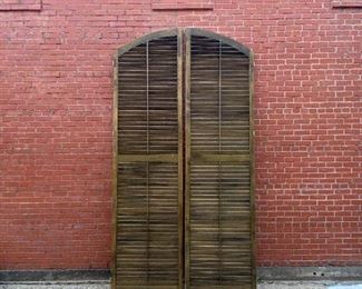 A pair of monumental wooden shutters 