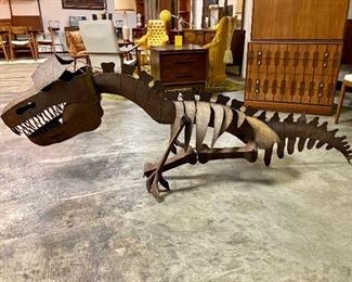 7ft long steel t-rex skeleton from the Fire escape of a downtown Calera building. I’m told that it was made by Charlie “Tin Man “ Lucas, but there’s no signature. 