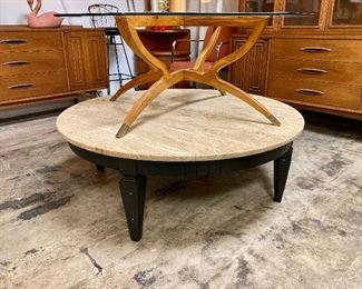Spider leg coffee table on top of a gorgeous travertine top coffee table