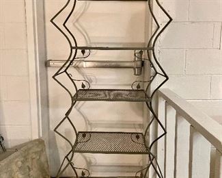 Very odd looking iron plant stand