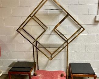 Brass geometric etagere with smoked glass shelves