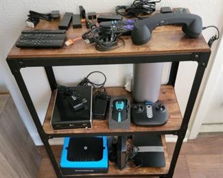 Rolling Shelf with Misc, Assorted Modems, Roku Streaming, Fire Sticks, LG Mopise CD Burner WIFI Prone