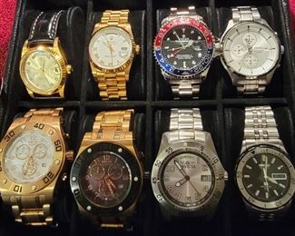 Left to Right Top: Replica Rolex Oyster Watch w/ Black Leather Band, Replica Rolex Oyster Watch with Gold Tone vBand, Replica Oyster Watch with Silver Band, Seiko Watch ,Left to Right Bottom: Invicta Reserve Collection Watch, Invicta Reserve Collection Invicta Watch, Seiko Sports Watch,