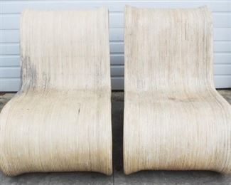 46 - Sculptural rattan pair of chairs - AS IS 36 x 25 x 46 Have been outside in the weather & they need to be cleaned