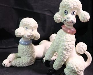 287 - Pair of 1950's ceramic Poodle Figurines One is 11" tall One is 12" across Both have crazing