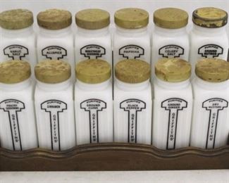 462 - 12 Pc Vintage spice set in wood rack 11 1/2 x 4 1/2 x 6 1/2