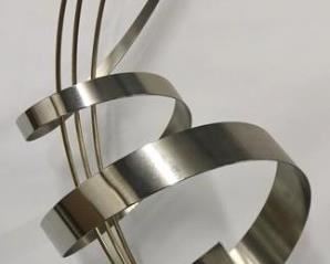 795 - Curtis Jere signed ribbon metal sculpture 36" tall Marble base