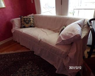sofa, slipcover ..floral fabric underneath