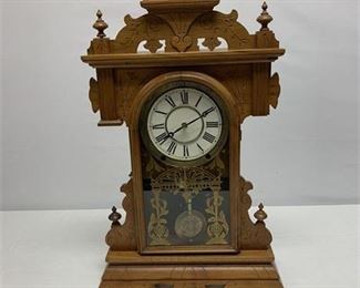 Lot 048
Antique Mantel Clock with Carved Wooden Case and Gold Accented Glass Door