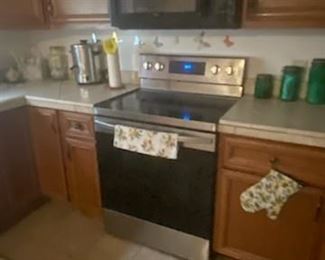 Stainless Steel Oven & Black Overhead Microwave