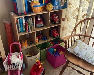 Toys and bookcase for sale during in person shopping Friday and Saturday
