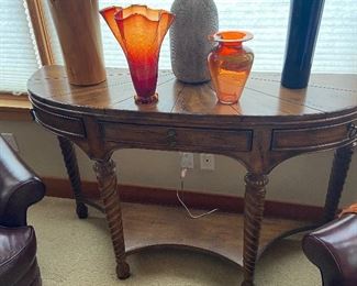 A demi-lune console table by Ferguson Copeland  16"d x 52"w x 33.5"h. $260