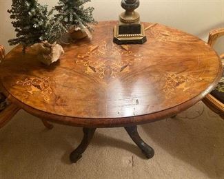 Beautiful oval inlaid table measures 27" x 41"w by 28"h.  $130 as found - photo of as found issue follows