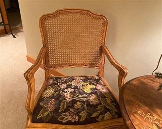 One of a pair of caned and embroidered armchairs  $120 for the set