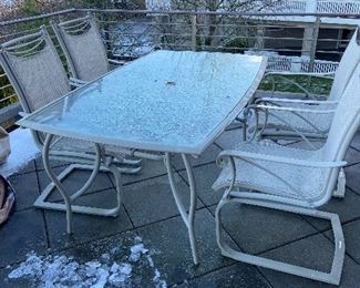 Outdoor table and four chairs $60. Table is 64"l x 28"h x 37"w