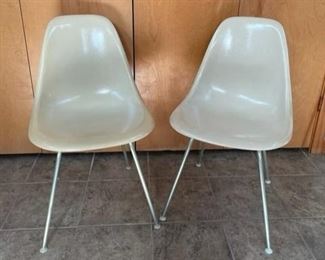 $750 *****REDUCED TO $600*****   SET OF 2 CHARLES EAMES FIBERGLASS SCOOP/SIDE CHAIRS 1950'S HERMAN MILLER
Classic set of 2 Charles Eames fiberglass scoop /side chairs 1950s Herman Miller. Both in a light concrete grey and in nice original condition.  Classic Mid-Century Modern design.
DETAILS + DIMENSIONS:
31.5H x18W x14D inches 
Seat Height 18 inches
CONDITION: Both chairs are in very good vintage condition.  These are authentic Mid Century pieces and have only minimal signs of superficial wear to be expected with age and light use. Please refer to photos for a more detailed look at condition.  We make every attempt to list and photograph any defects or signs of wear that are significant to this sale. 
LOCAL PICKUP MCLEAN, VA.  BUYER IS RESPONSIBLE FOR ANY NECESSARY DISASSEMBLY AND ALL COSTS ASSOCIATED WITH SHIPPING OR PICK UP.  PLEASE CONTACT US FOR SHIPPING RECOMMENDATIONS.