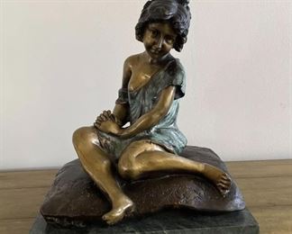 Original Bronze designed by A. (Auguste) Moreau, French Bronze Artist - 1834-1917. The piece is numbered 167-1456. the base is 12 by 9 inches, height 14 inches, weight 21.4 lbs. The young child is innocently seated o a cushion, there is a floral motif around the base of the cushion. Every aspect of the bronze is in perfect detail and without any damage or evidence of repair. The patina is exquisite. On original base with felt bottom.