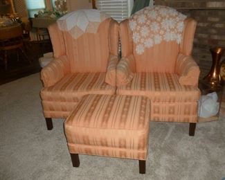 Pair of Peachy colored wingback chairs w/ottoman