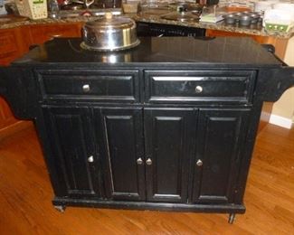Black marble-top kitchen island