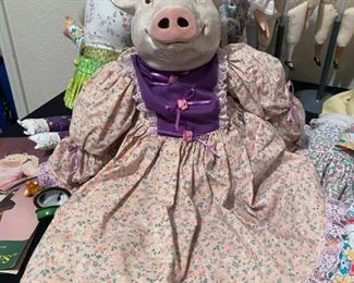 Ceramic pig doll in dress and straw hat