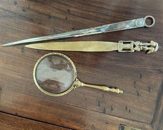 Letter openers and magnifying glass. 